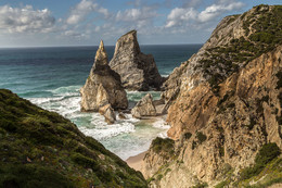  / Beautiful Ocean Beach at sunset Praia da Ursa aerial view