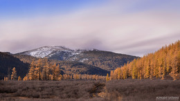  / Genghis Khan (also known as Chinggis Khan) lost his battle against the Merkit (one of the major tribal confederations (khanlig) of the Mongols) and escaped death by seeking protection in the sacred precincts of the Burkhan Khaldun mountains. An old woman saved him and a few others. As mark of great reverence to the mountain, which in Mongolia is considered a highly sacred mountain of spiritual significance, and to the sun above, he offered his respects to the spirits of the mountain around him, sprayed milk into the air and sprinkled it on the earth. He removed his girdle strap, unwinding it from his outfit, and then put it around his neck.
https://en.wikipedia.org/wiki/Burkhan_Khaldun