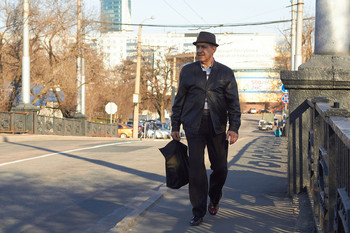  / He is walking through the city