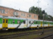 at the station in the rain / ***