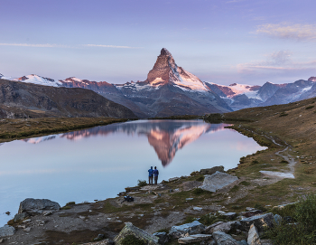 Matterhorn reflection in Lake Stellisee Switzerland / Mount Matterhorn sunset reflection in Lake Stellisee, Zermatt, Switzerland. Autumn landscape.