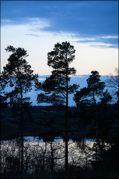 Blue Night / deep blue shadows in the late evening on the lake between the hills