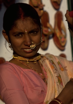 Facial Jewellery of Indian girl in Rajasthan / Of the many jewels an Indian woman displays around her body, the nose ornament (nath) is perhaps one of the most eye-catching.
The bindi, or forehead jewel, is placed on the area which is believed to house the agya chakra, or third eye.
These examples of Indian facial jewellery complement the earrings and necklace beautifully.
https://travelnotes.org/pics/Asia/01-Rajasthan.htm