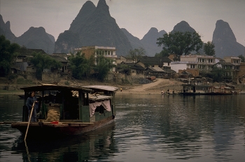 Guilin Limestone Peaks / Guilin is flat enough to cycle around and then these magnificent limestone peaks rise up in front of you.
A cruise down the river, from Guilin to Yangshuo, passes through some of China's most magnificent scenery.
Nature has spent 70 million years perfecting the sculptures around this part of the Li River; revealing a landscape that is truly awesome.
https://travelnotes.org/pics/Asia/06-Guilin_Limestone_Peaks.htm