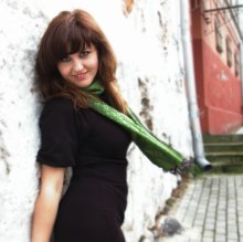 she's wearing green scarf / here again