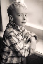 portrait of a boy at the window / .......................