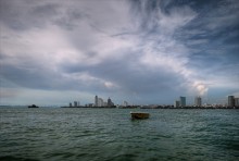 The boat, the sea, town / ***