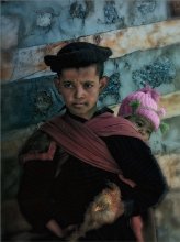 Portrait of a boy with chicken / *****