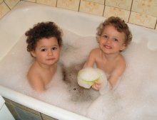 Bathing children / ***
