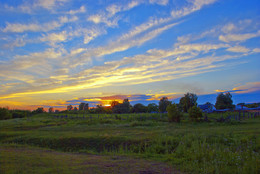 Sunset over the village / ***