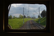outside the door of the last car / ***
