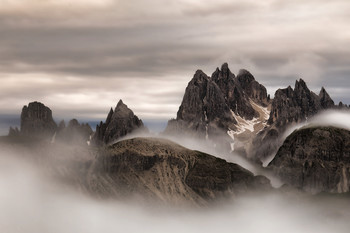 "Dramatic sunrise" Cadini di Misurina - Dolomites / The Cadini di Misurina are a mountainous group of the eastern Dolomites in the province of Belluno. They lie west of Auronzo di Cadore, north-east of Cortina d'Ampezzo and south of Dobbiaco, in a position overlooking the lake of Misurina. The highest peak is the Cima Cadin di San Lucano (2,839 m s.l.m.). They are part of the subsection Dolomiti di Sesto, of Braies and d'Ampezzo and belong to the municipality of Auronzo di Cadore. The term Cadini derives from the Cadore Ciadìn (Ciadìs in the plural) that can be translated into valleys, of which the chain is full and makes the whole of the peaks a labyrinth.