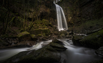 Sgwd Rhyd Yr Hesg / Sgwd Rhyd Yr Hesg (Melincourt Falls in English) very picturesque set of waterfalls near Resolven in the Vale of Neath in South Wales. They are formed by the brook plunging 80 feet over a resistant band of 'Lower Pennant Sandstone'.
They are a few miles to the South West of the main 'Waterfall Country' around Pontneddfechan, but if you are down that way, I would recommend making the detour.