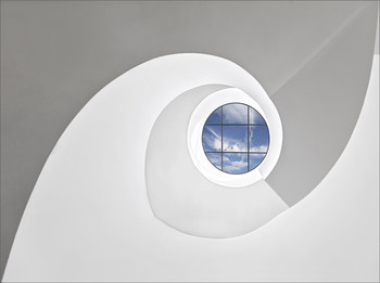 Stairwell at the Leitz company / ... view from the bottom up
You will find two Spiral stairs at the Leica headquarters in Wetzlar . One size (large diameter), but this is only accessible on special occasions (this picture shows the stairwell of the larger spiral staircase) and a small spiral staircase (small diameter)
the it goes over several floors. The small stair are accessible because that leads to the customer’s toilet.