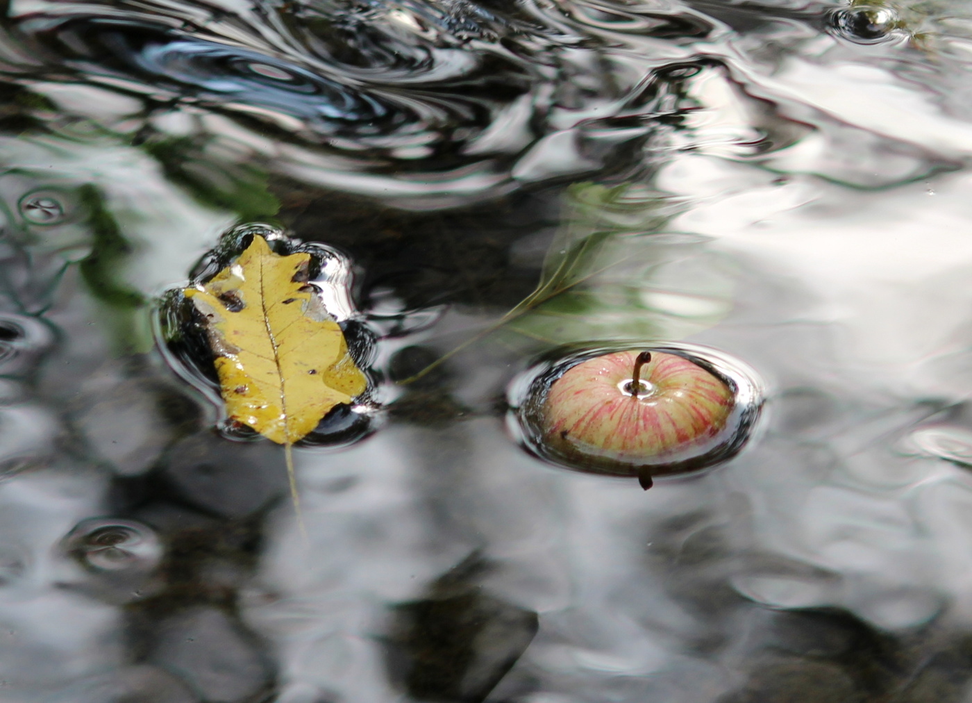 По течению.