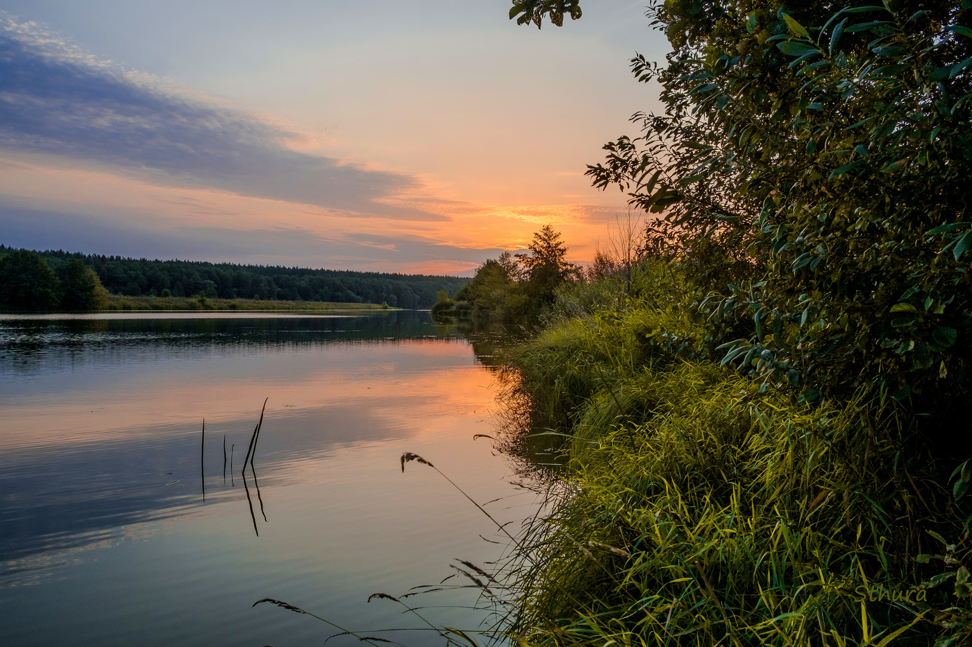 Вдоль берега.