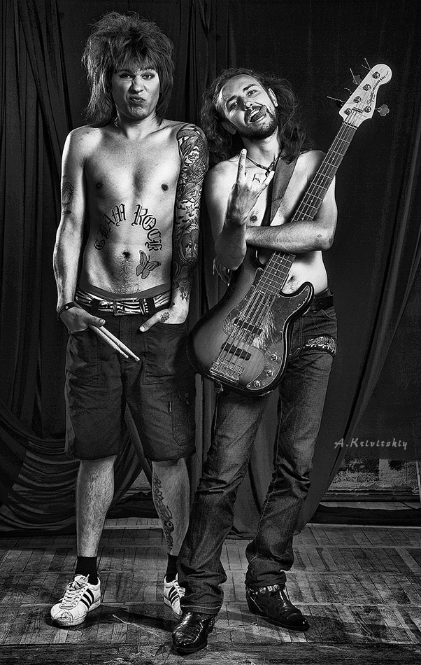 Musician - determining a noun. Man, to-ing is engaged in playing a musical instrument.